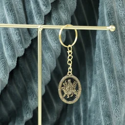 Maa Durga Golden Oval Frame Keychain – Spiritual Protection