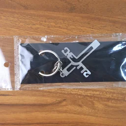 Metal Cross Keychain – Gujarati Jesus Script for Spiritual Style