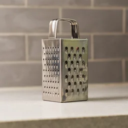 Stainless Steel 4-in-1 Compact Grater & Slicer – Durable Kitchen Tool