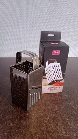 Stainless Steel 4-in-1 Compact Grater & Slicer – Durable Kitchen Tool