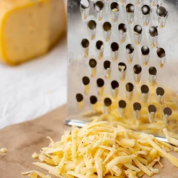 Stainless Steel 4-in-1 Grater & Slicer – Multipurpose Kitchen Tool
