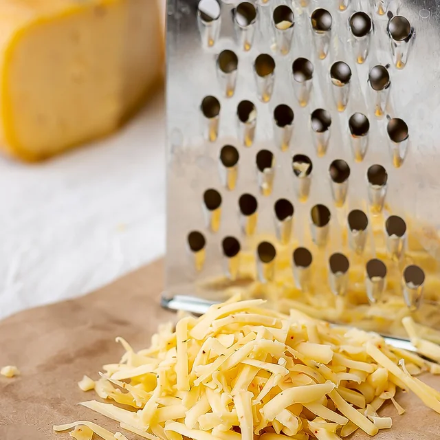 Stainless Steel 4-in-1 Grater & Slicer – Multipurpose Kitchen Tool