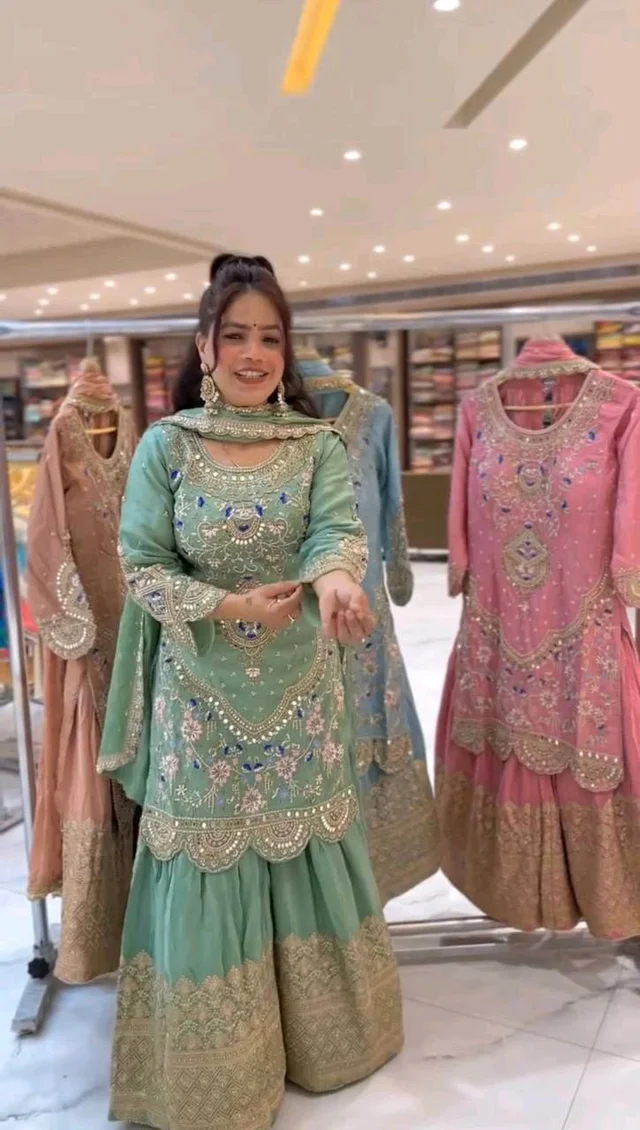 Stylish Heavy Work Teal Green Color Sharara Suit
- Pista, XL