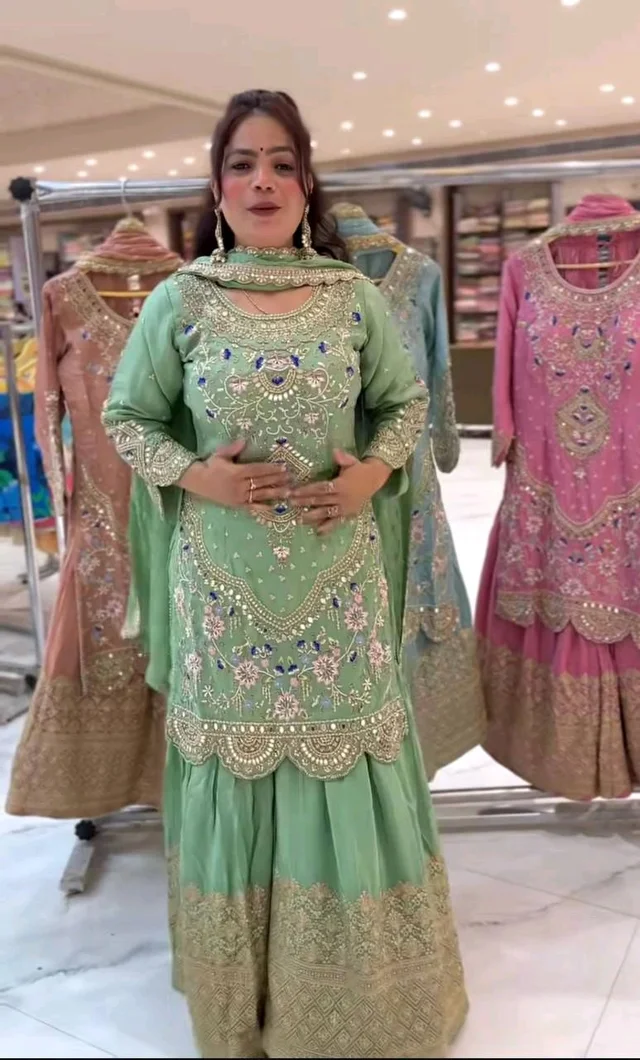 Stylish Heavy Work Teal Green Color Sharara Suit
- Pista, XXL