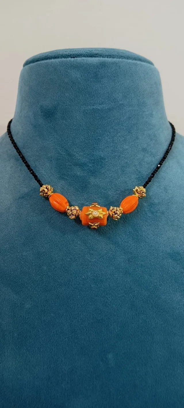 Black beads with carved coral (11685)