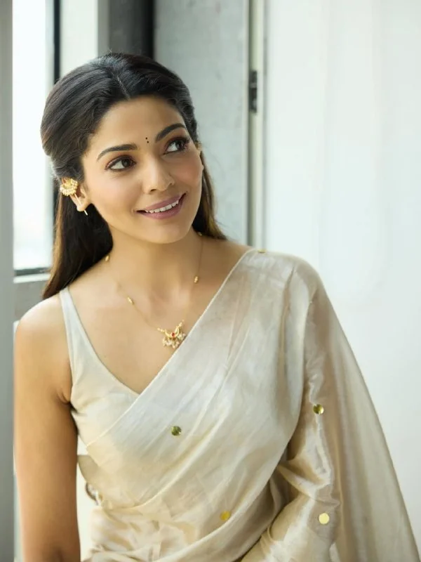 Celebrity Pooja Sawant Inspired Premium Raga Tissue Silk Saree with Elegant Round Butti and Tassels