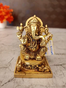 DecorsOne Brass Ganesha statue Sitting On Square base With Kalasam / Anchor Your Home in Divine Tranquility with Our Seated Brass Ganesha Idol