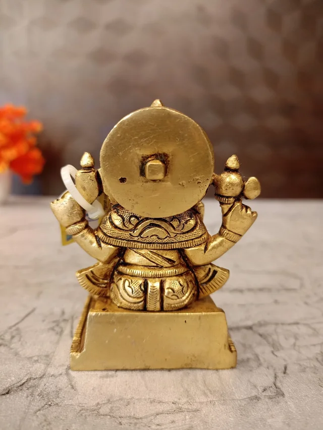 DecorsOne Brass Ganesha statue Sitting On Square base With Kalasam / Anchor Your Home in Divine Tranquility with Our Seated Brass Ganesha Idol