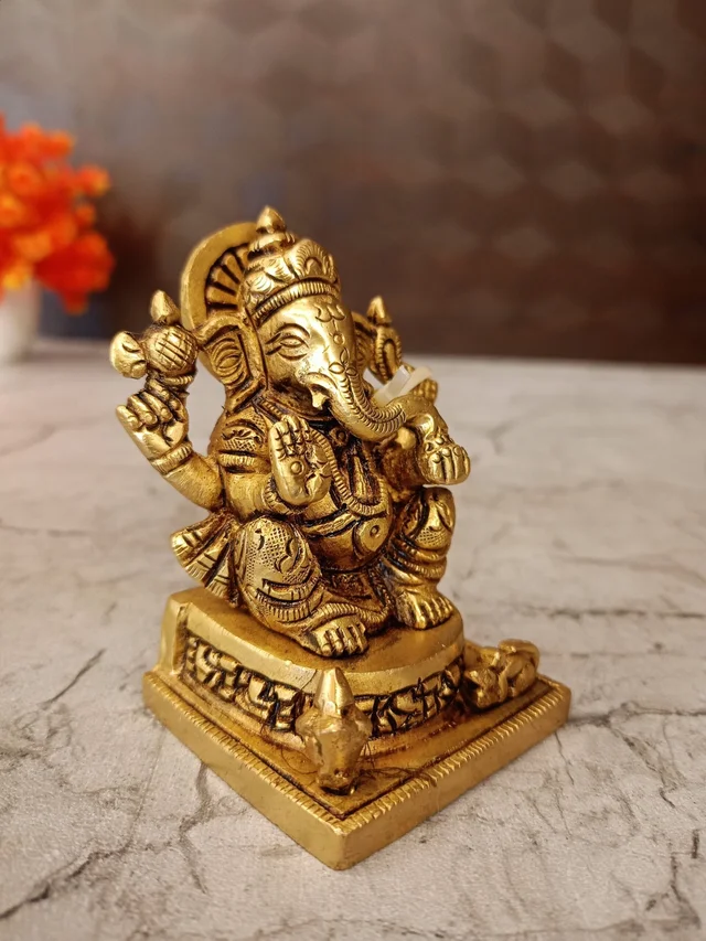 DecorsOne Brass Ganesha statue Sitting On Square base With Kalasam / Anchor Your Home in Divine Tranquility with Our Seated Brass Ganesha Idol