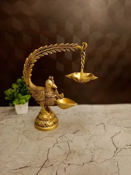 DecorsOne Illuminate your space with the Premium Brass Single Face Peacock Hanging Diya (Mayil Deepam).