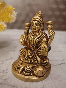 DecorsOne Buy Brass Lakshmi Idol Sitting On Round Base With Flowers