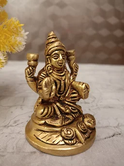 DecorsOne Buy Brass Lakshmi Idol Sitting On Round Base With Flowers