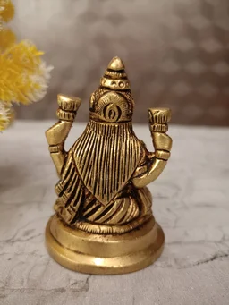 DecorsOne Buy Brass Lakshmi Idol Sitting On Round Base With Flowers