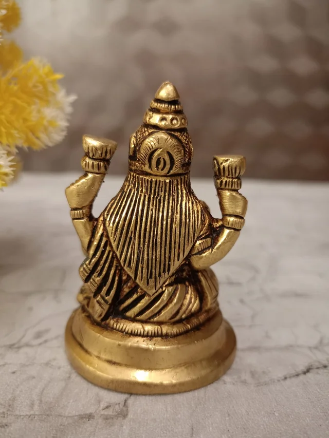 DecorsOne Buy Brass Lakshmi Idol Sitting On Round Base With Flowers