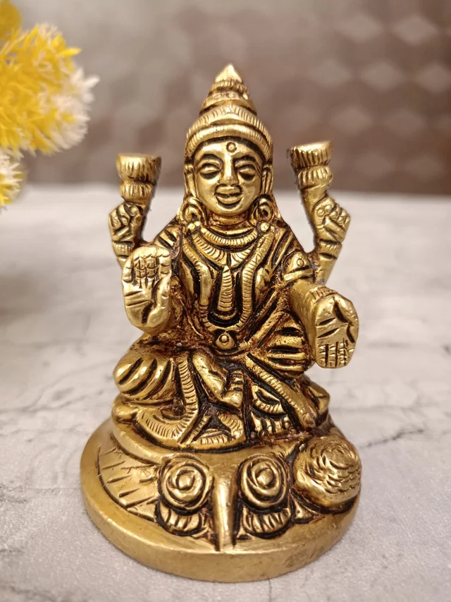 DecorsOne Buy Brass Lakshmi Idol Sitting On Round Base With Flowers