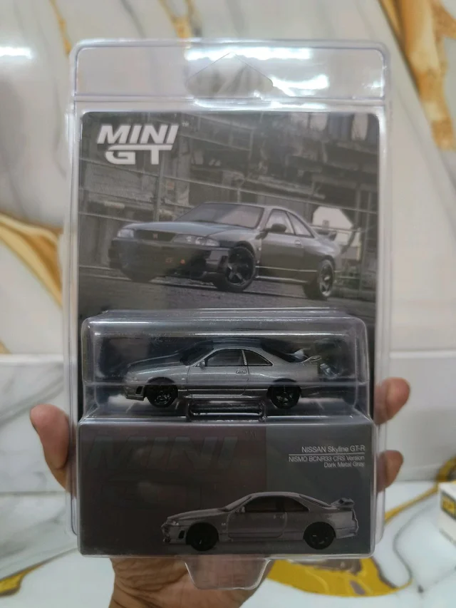 NISSAN Skyline GT-R Dark Metal Gray (NISMO BCNR33 CRS Version) - Scale 1/64 MGT01128 Blister packing