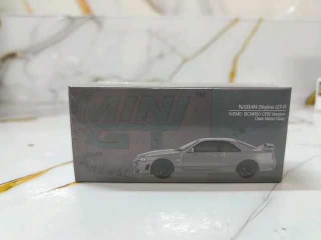 NISSAN Skyline GT-R Dark Metal Gray (NISMO BCNR33 CRS Version) - Scale 1/64 MGT01128 Box packing