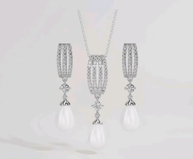 CLARA 925 Sterling Silver Pearl Queen Pendant Earring Chain for Women
Gift for Women & Girls | Platinum Plated | Swiss Zirconia | Jewellery Set