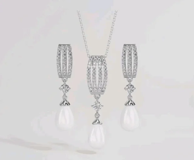 CLARA 925 Sterling Silver Pearl Queen Pendant Earring Chain for Women
Gift for Women & Girls | Platinum Plated | Swiss Zirconia | Jewellery Set