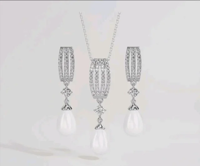 CLARA 925 Sterling Silver Pearl Queen Pendant Earring Chain for Women
Gift for Women & Girls | Platinum Plated | Swiss Zirconia | Jewellery Set