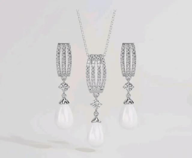 CLARA 925 Sterling Silver Pearl Queen Pendant Earring Chain for Women
Gift for Women & Girls | Platinum Plated | Swiss Zirconia | Jewellery Set