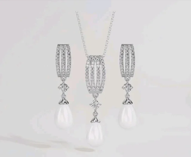 CLARA 925 Sterling Silver Pearl Queen Pendant Earring Chain for Women
Gift for Women & Girls | Platinum Plated | Swiss Zirconia | Jewellery Set