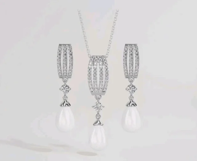 CLARA 925 Sterling Silver Pearl Queen Pendant Earring Chain for Women
Gift for Women & Girls | Platinum Plated | Swiss Zirconia | Jewellery Set
