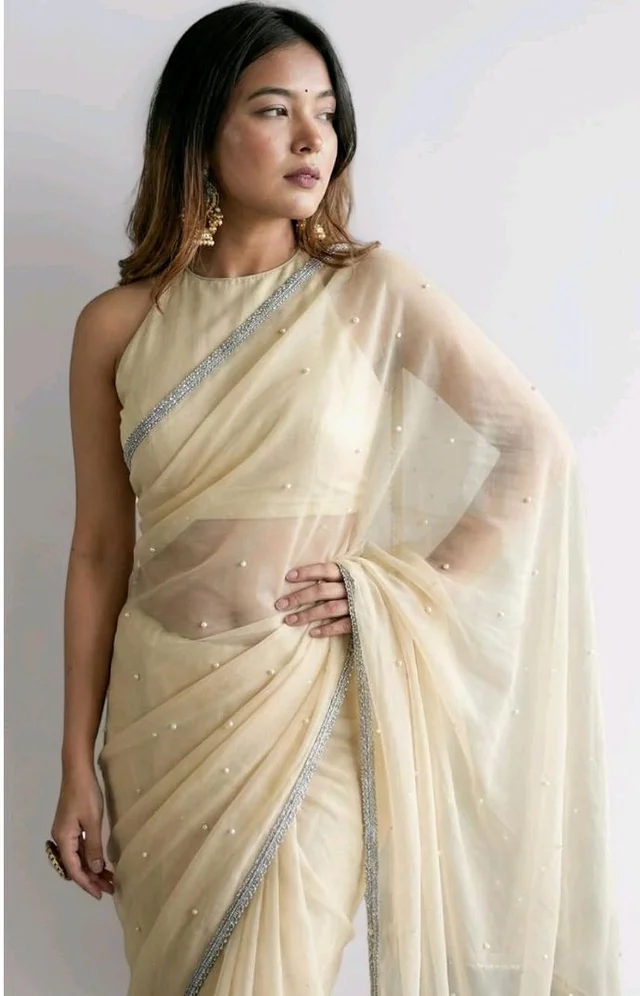 Brand: Unique Store
2.8 out of 5 stars 13
Unique Store Women Sari with Net Fabric, Elegant Lace Border and Pearl Work, Designer Saree for Wedding, Festive & Special Occasions