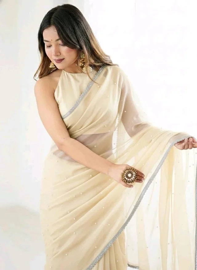 Brand: Unique Store
2.8 out of 5 stars 13
Unique Store Women Sari with Net Fabric, Elegant Lace Border and Pearl Work, Designer Saree for Wedding, Festive & Special Occasions