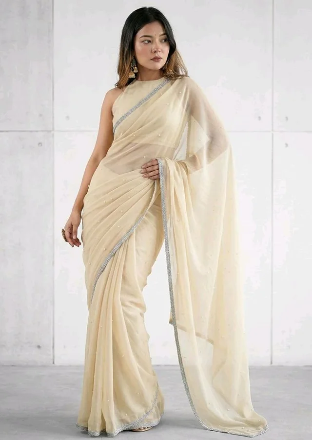Brand: Unique Store
2.8 out of 5 stars 13
Unique Store Women Sari with Net Fabric, Elegant Lace Border and Pearl Work, Designer Saree for Wedding, Festive & Special Occasions