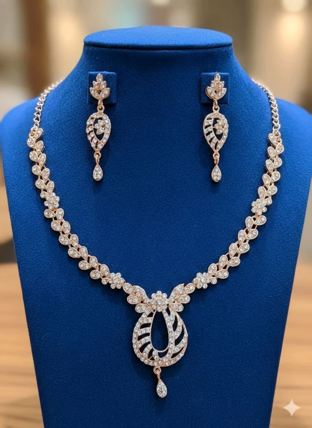 DSH Fashion Rose Gold Leaf & Vine Bridal Jewelry Set – Crystals Embellished Teardrop Necklace with Matching Leaf-Drops Earrings for Weddings, Ethereal Garden Rose Gold Suite: Shimmering Cubic Zirconia Swirl Necklace & Delicate Teardrop Earrings Set.