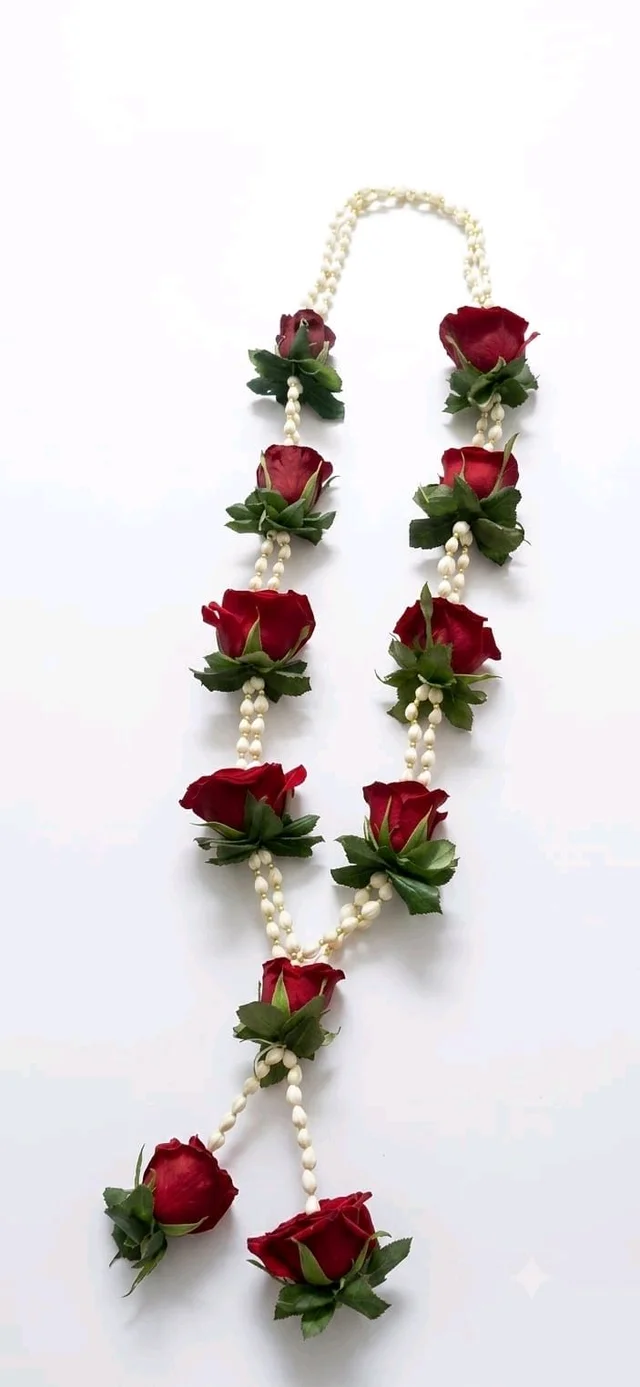 White Kadi Details With Rich Red Rose Garland